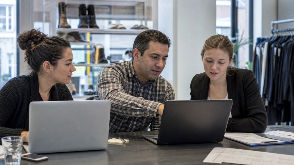 Laptop and notes for custom web application planning